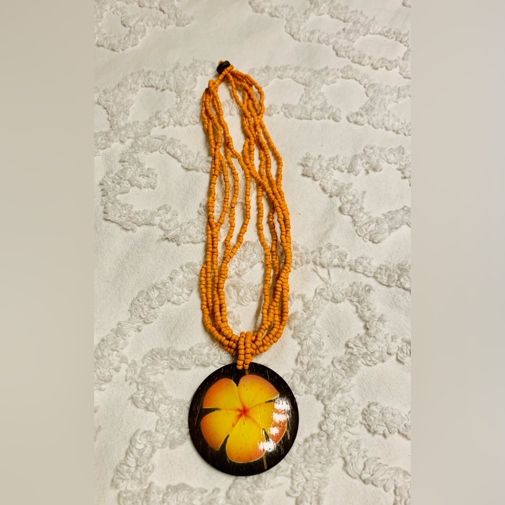Beaded necklace with wood pendant